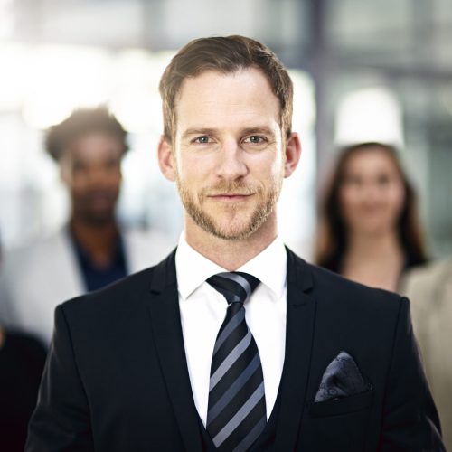 Corporate confidence. Cropped portrait of a group of businesspeople standing in the office