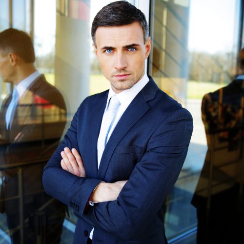 portrait-of-a-confident-businessman-standing-with-2026-01-09-14-54-41-utc