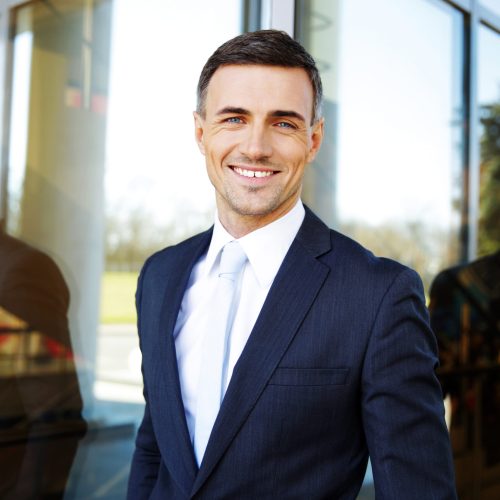 Portrait of a smiling handsome businessman in suit